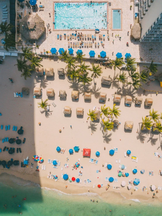 the overhead view of a beach and pool, from above