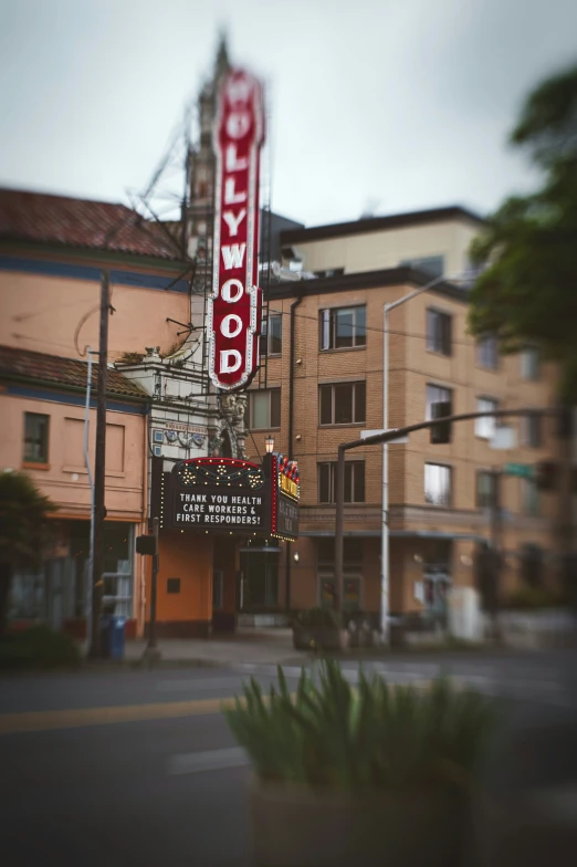 the el marquee is next to some tall brown buildings