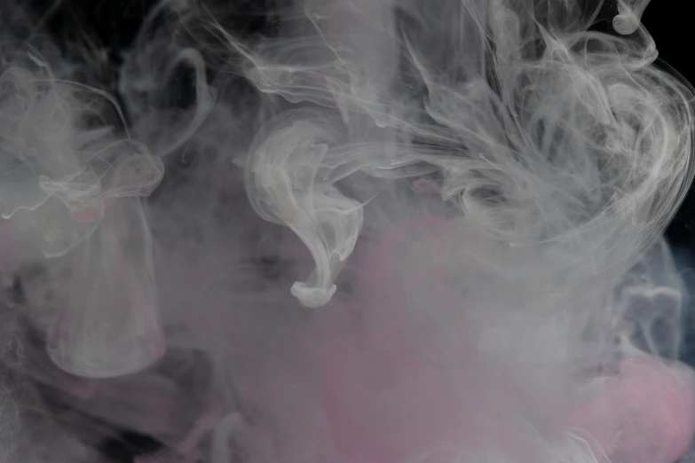 smoke moving through the air with a black background