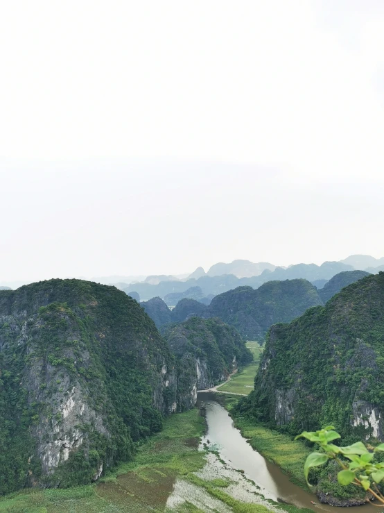 several green hills with some water and land below