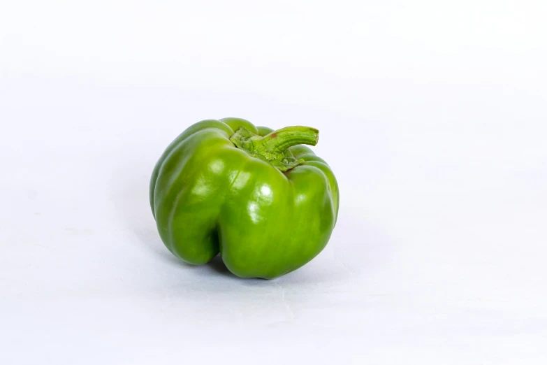 a green pepper is shown on a white background