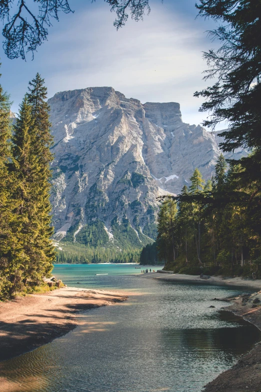 the view of a mountain and a river from below