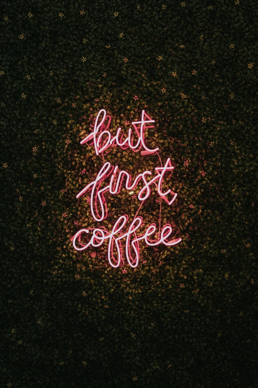 a neon sign that reads, but first coffee