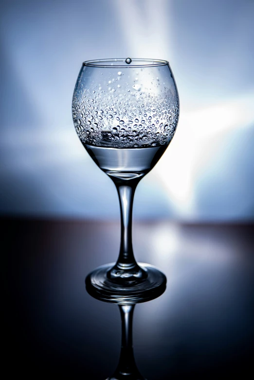 a close up view of a clear goblet with water inside