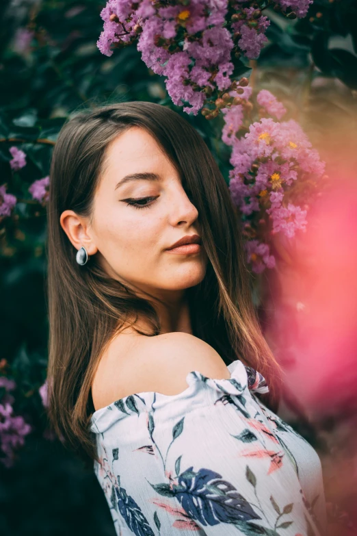 a girl in white is posing for the camera