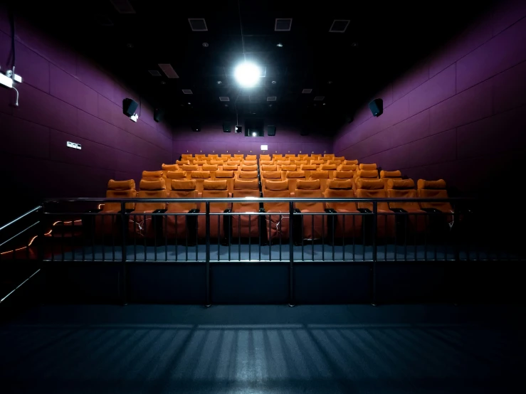 a very empty theatre with chairs and lights