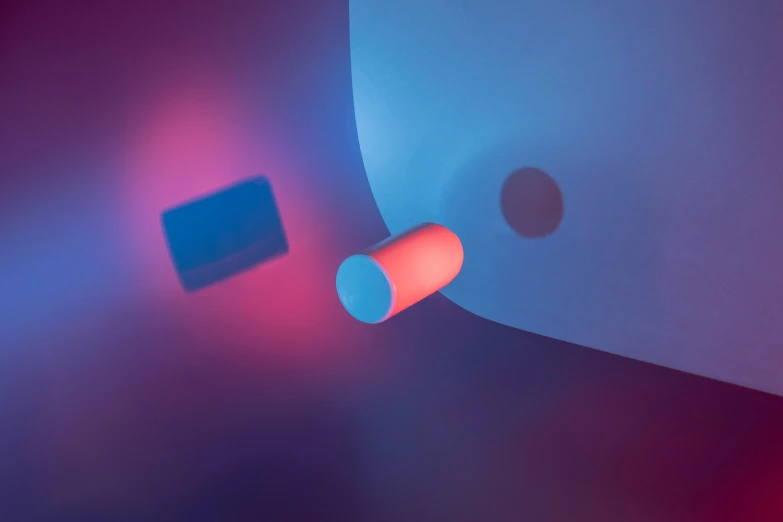 an image of a blue and red background with a white light coming through the corner