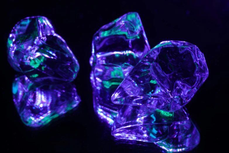 the bright purple crystal rocks are next to each other