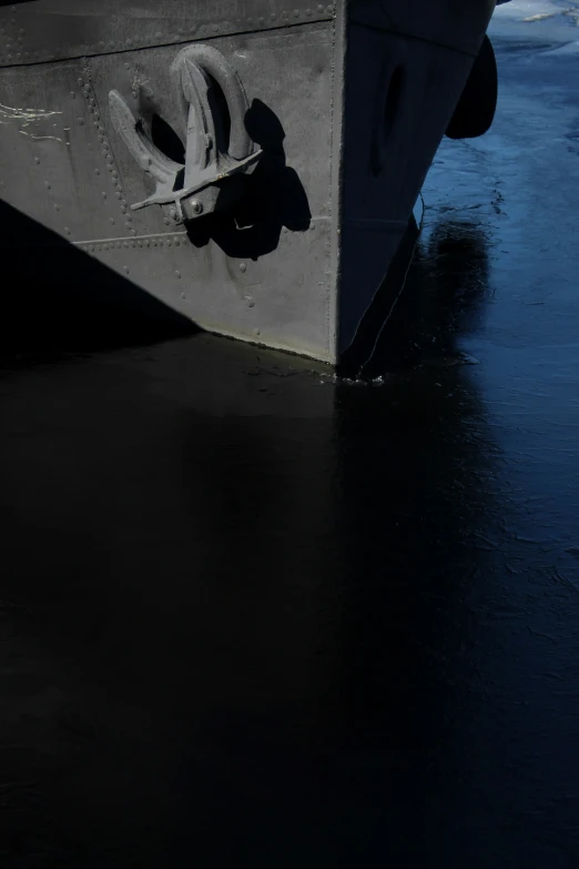 a closeup of the side of a boat in the water