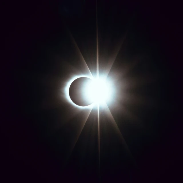 a bright, solar eclipse in a dark sky