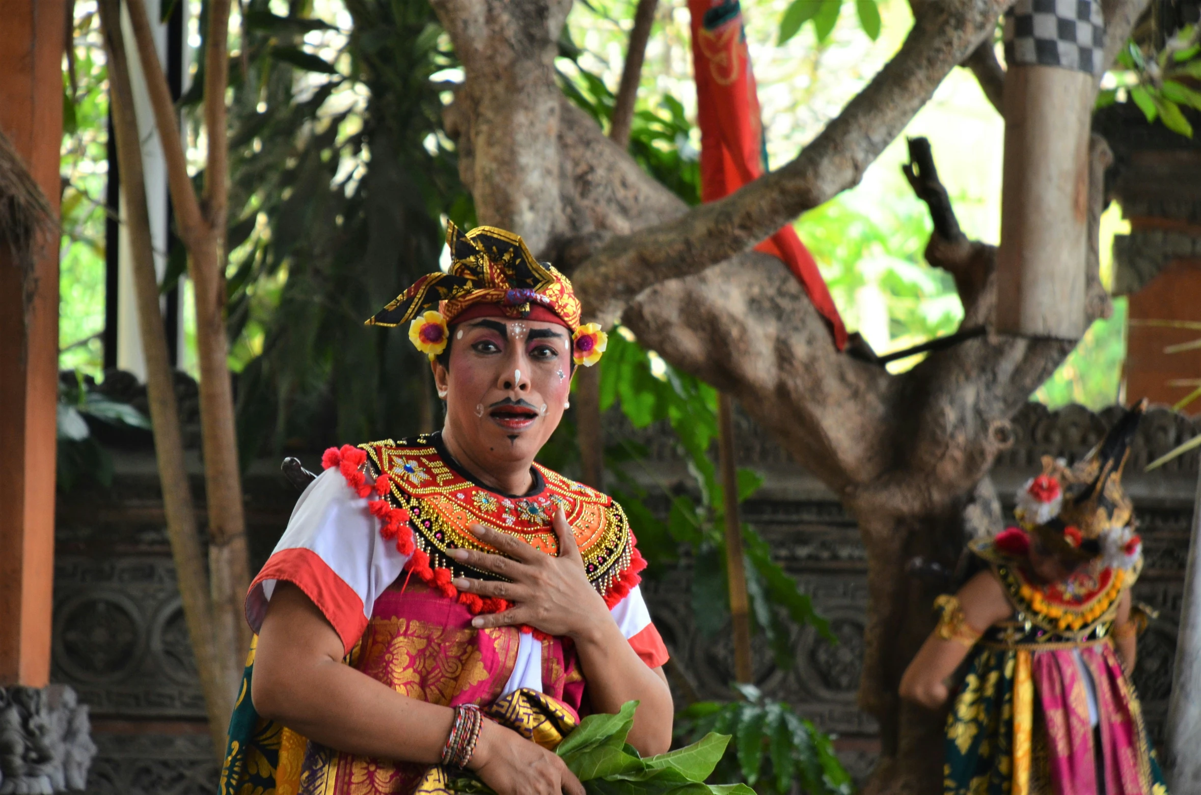 two people dressed in bright colorful clothing