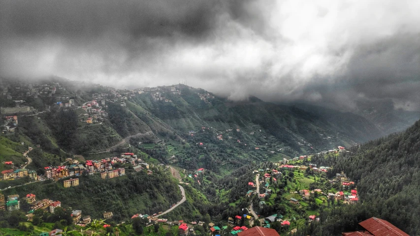 stormy skies hovers over a mountainous town