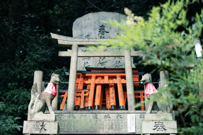 a wooden bench with statues around it