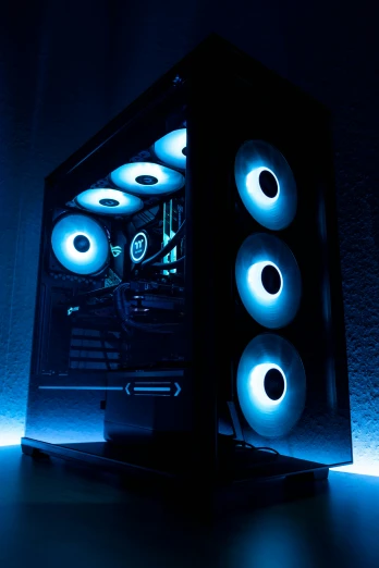 a black computer case with blue lights surrounding it