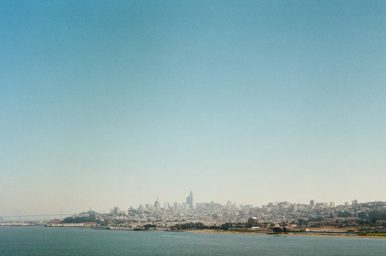 city across the water as seen from a shore line