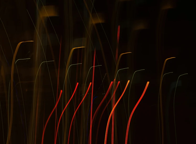 bright red lines streak across the image against a black background