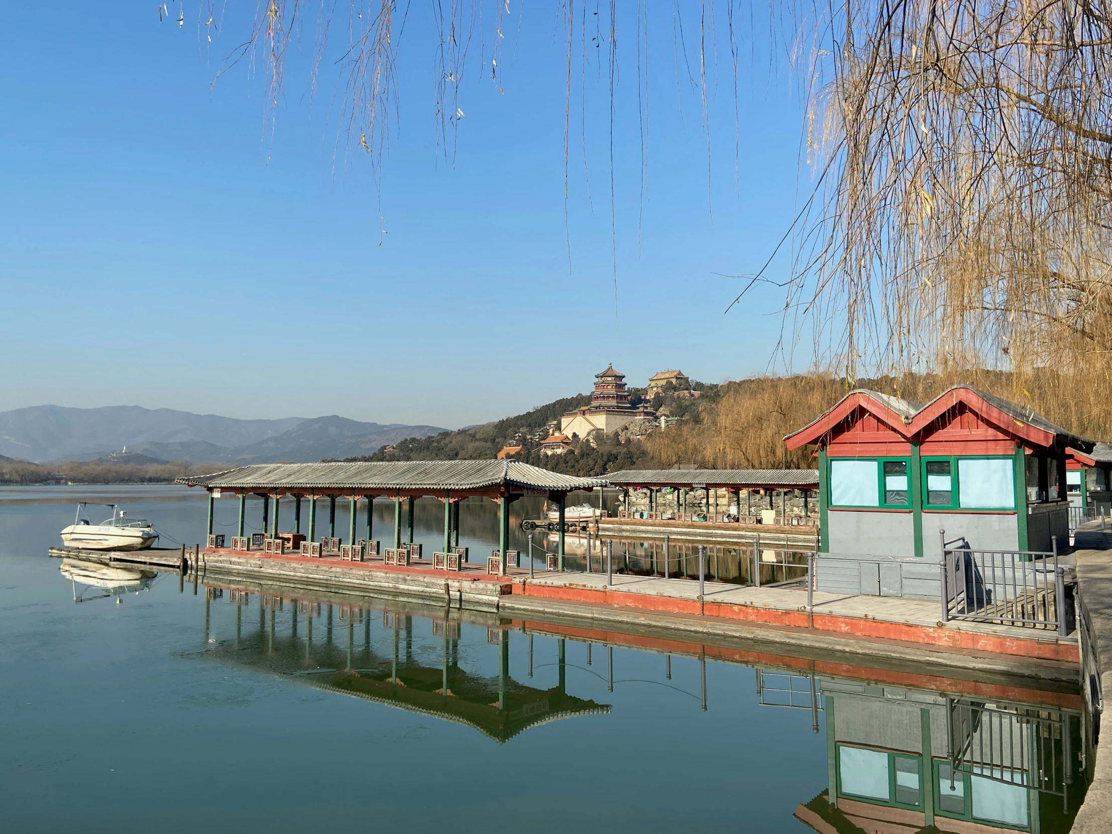 two boats docked in a lake and on the water