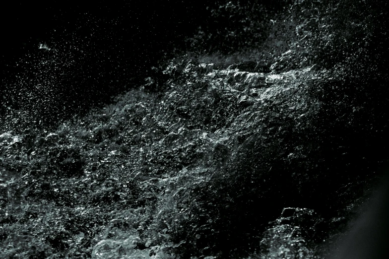 a dark ocean with many bubbles floating on it