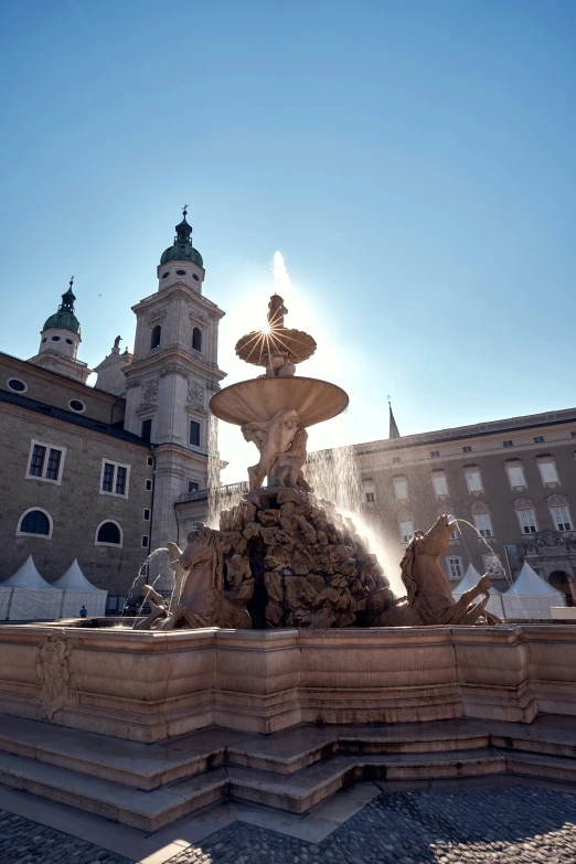 a large fountain with some statues on top of it