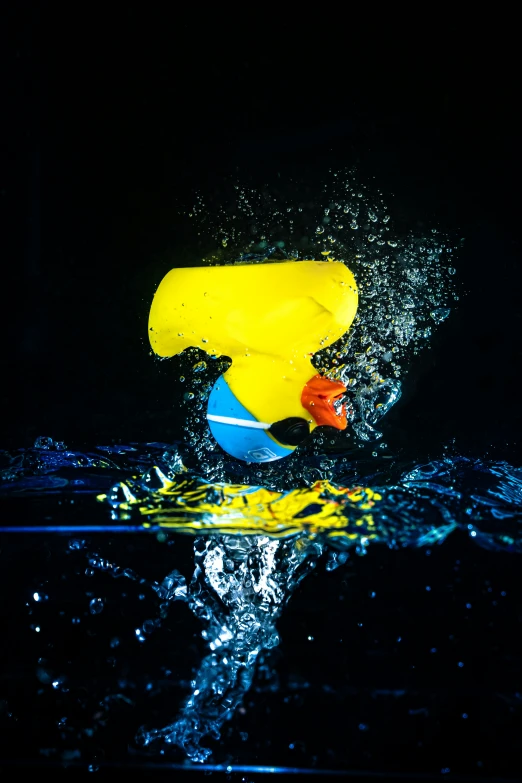 a yellow and blue ball that is in the water