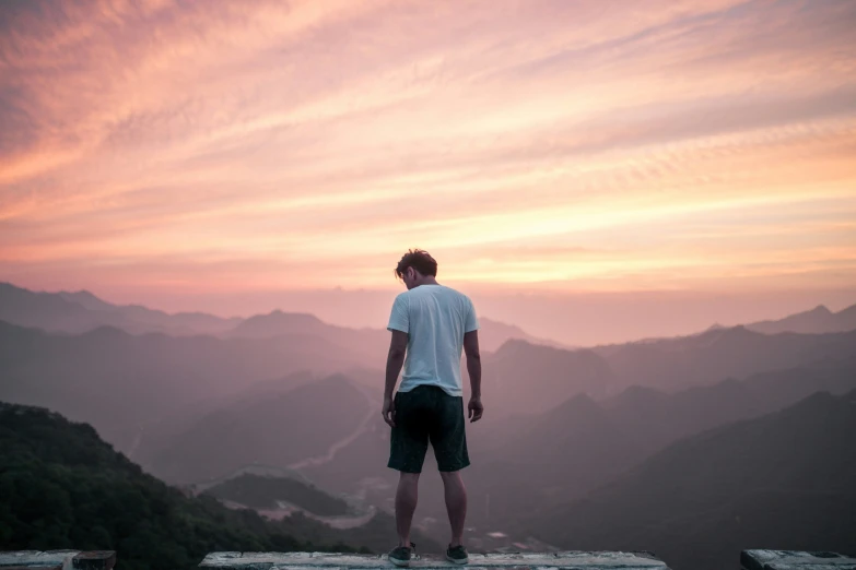 a person is standing at the top of a hill