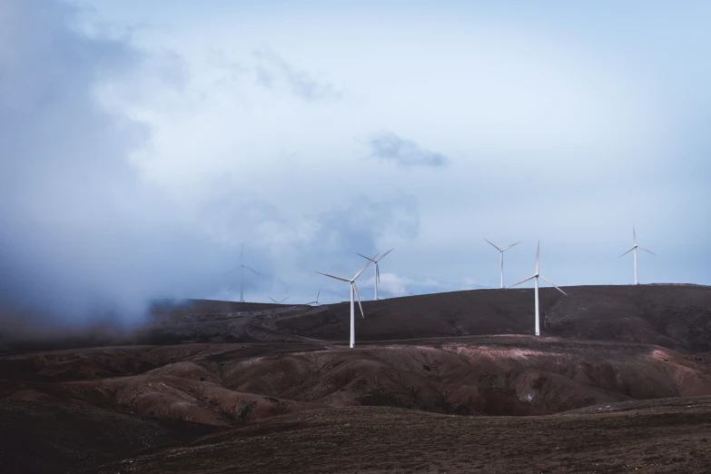 a group of wind generators in the countryside