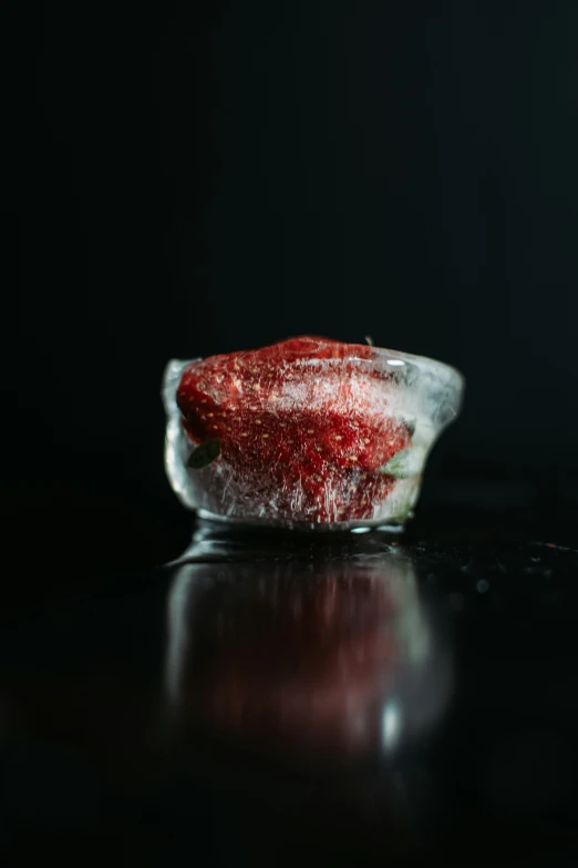 an empty strawberry slice on a glass plate with silver foil