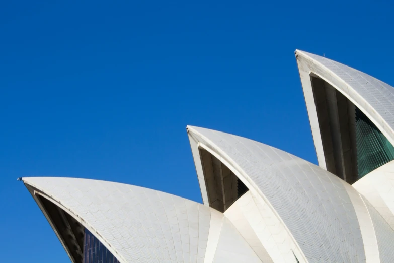 a close - up of the building's modern architecture features curved and angled panels