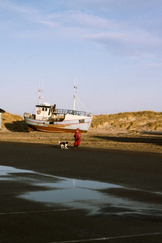 a person in red is by the boat