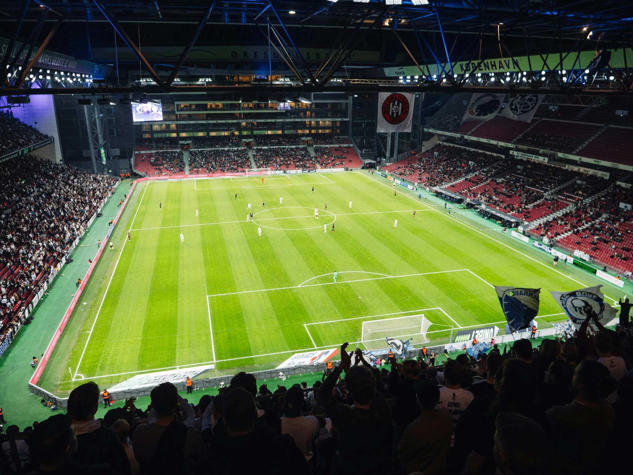 a large sports stadium with many players on it