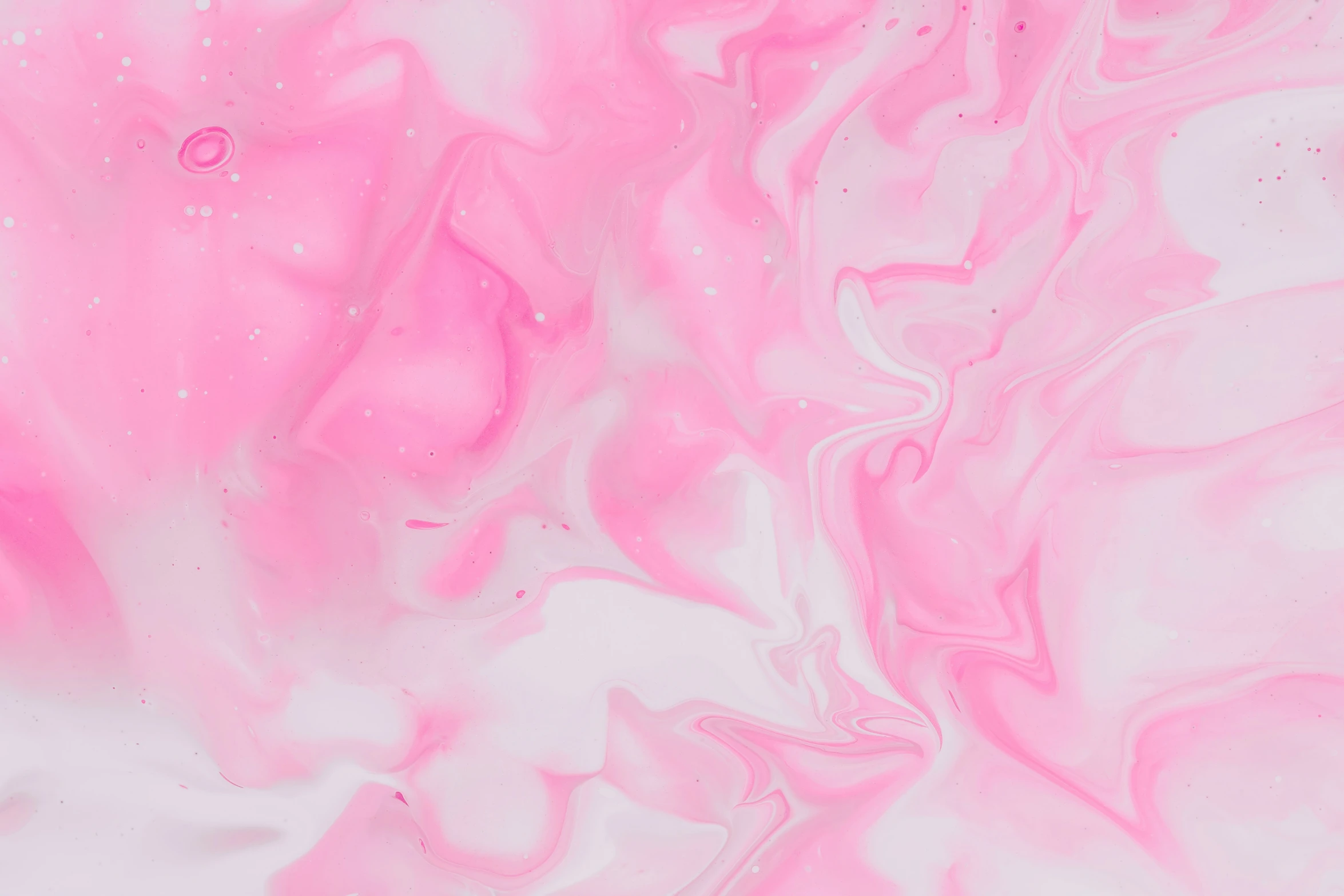 a white and pink textured liquid or substance