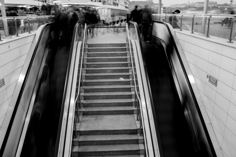 a person riding an escalator in a building