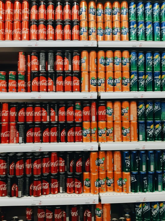 a shelf of soft drinks at a store