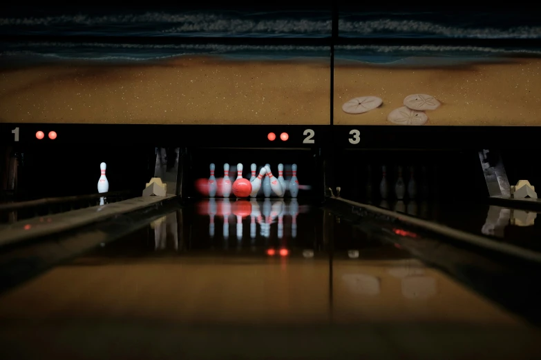 there is a group of bowling pins going through a line