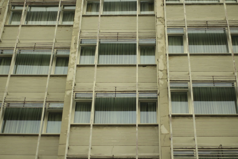 a large apartment building with multiple balconies