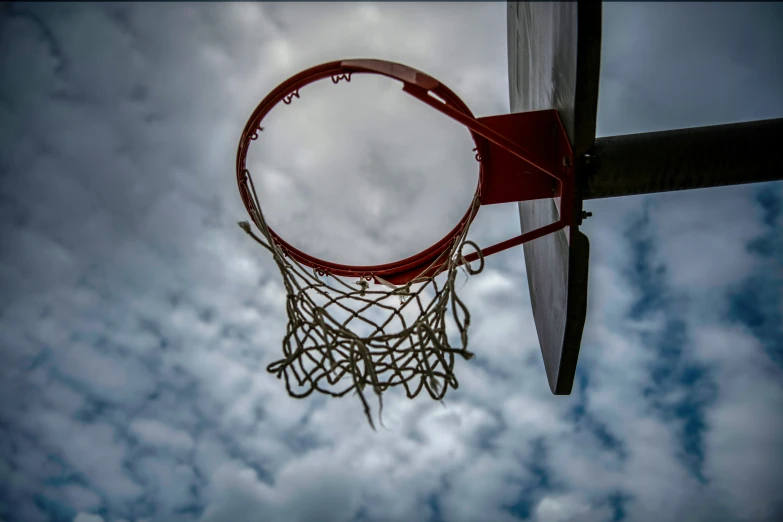 a basketball is seen in midair from the rim of the basket