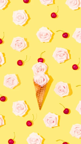 a background pattern with ice cream, cherry and rose petals