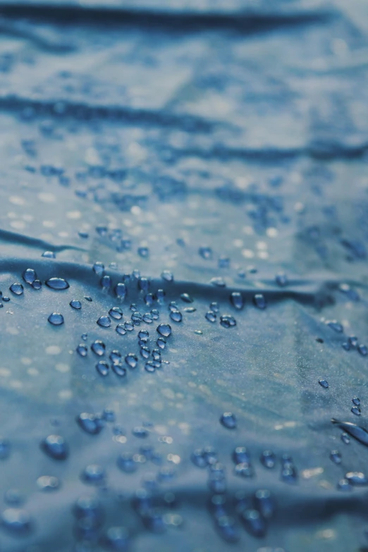 a blue watercolored background with small bubbles