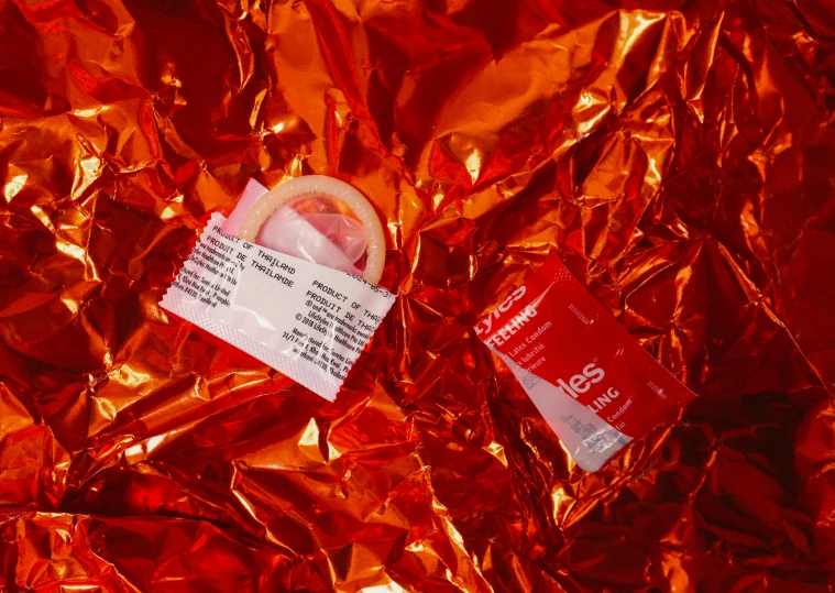 a red plastic wrap filled with a small white piece of paper