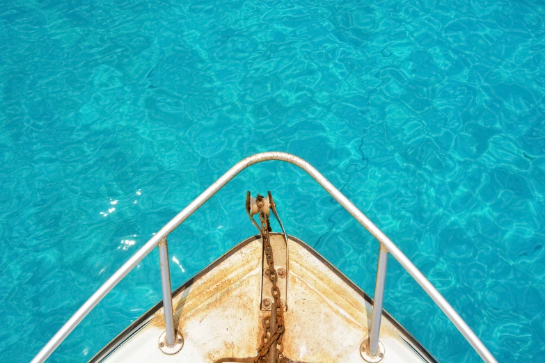 a boat is out in the water next to the shore