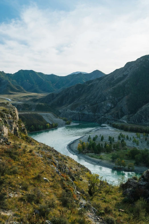 the small river runs between two mountains