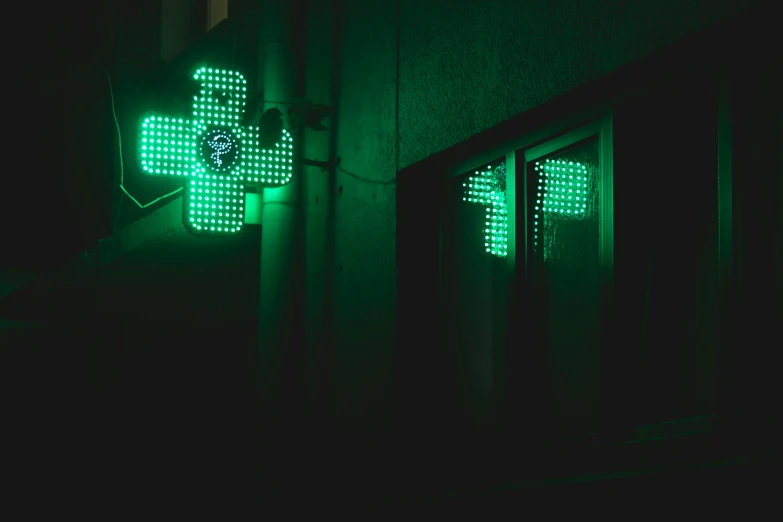 green cross is lit up for an event