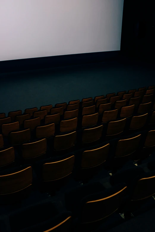 an empty auditorium seat with an empty screen