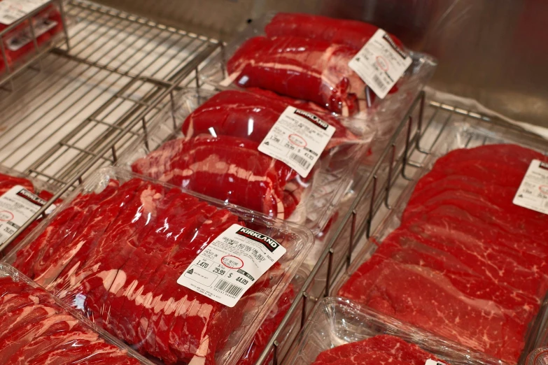 trays of beef in meat storage at market