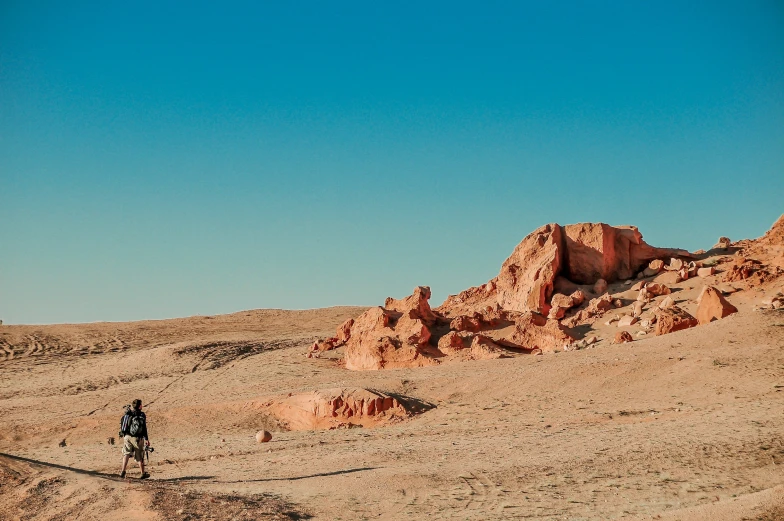 a man riding his bike in the desert