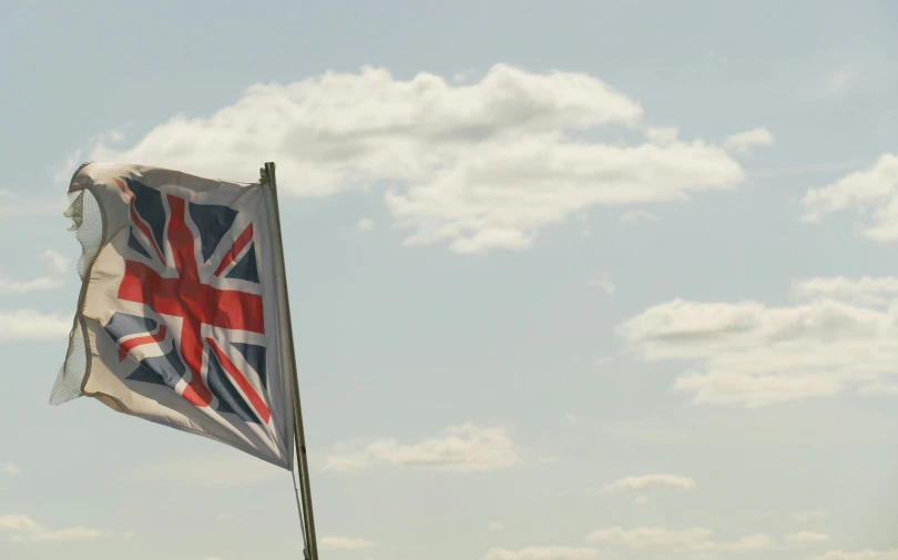 there is a british flag flying in the air