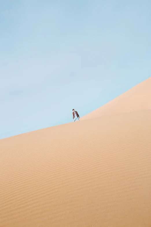 two people are standing in the middle of the desert