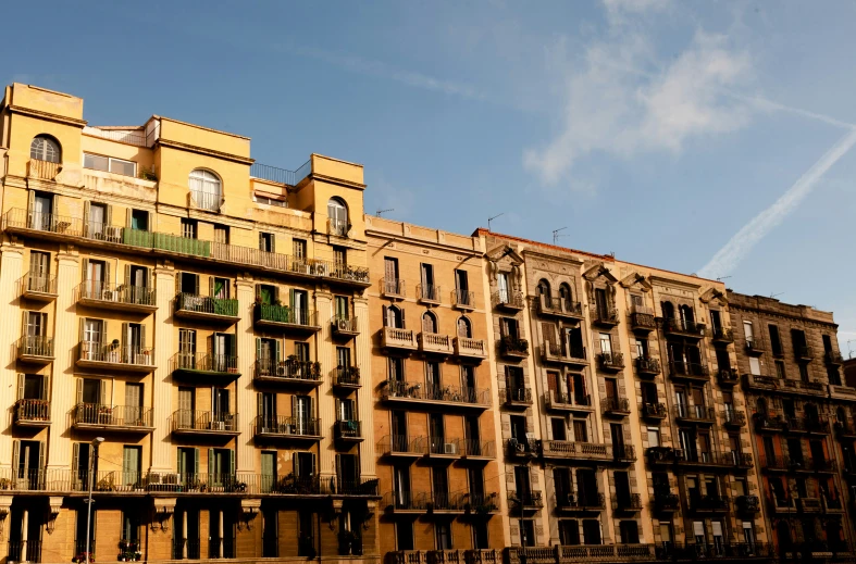 there are many buildings with balconies on each of them