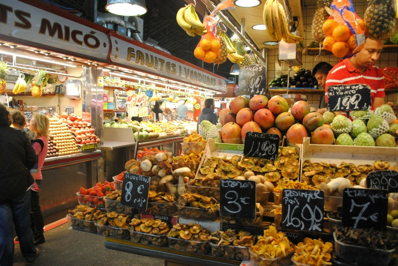 an assortment of fruits and vegetables on display