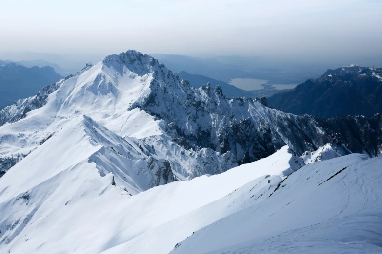 a view of the top of mountains covered in snow